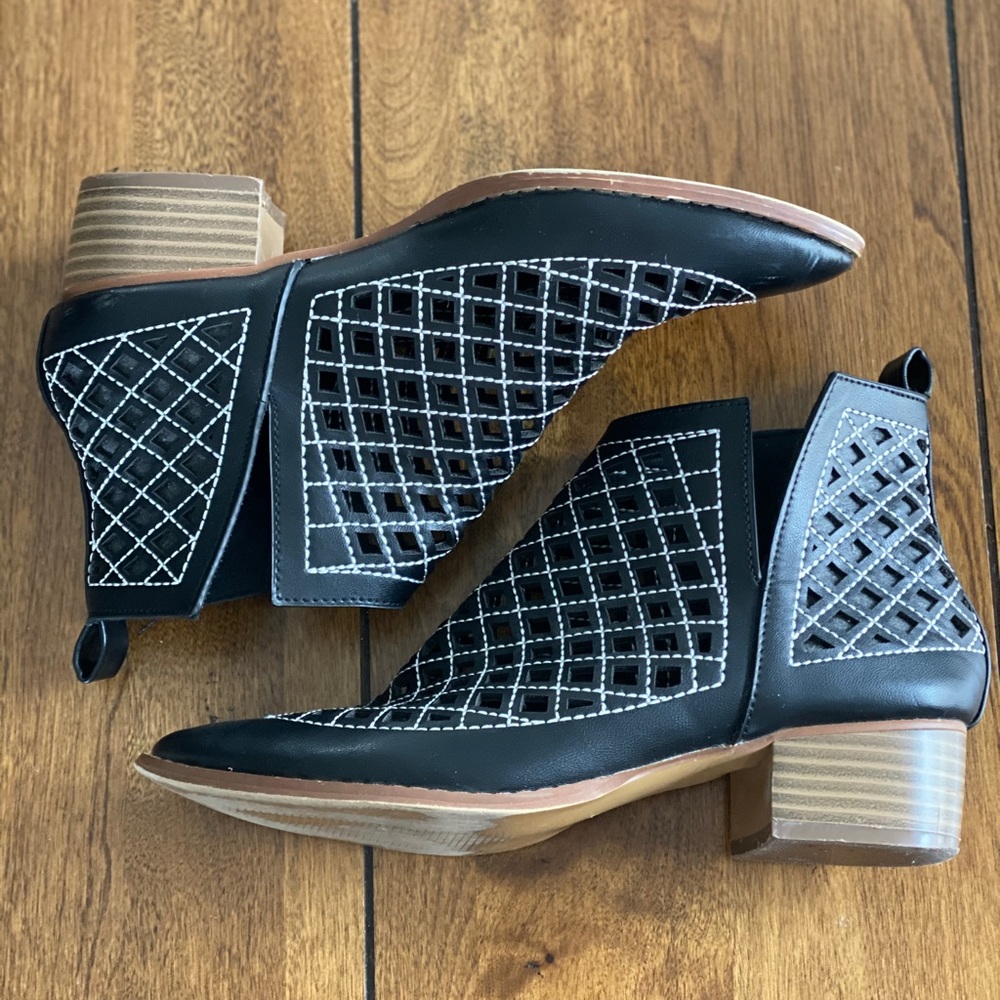 Black booties with slide slit, geometric cut outs